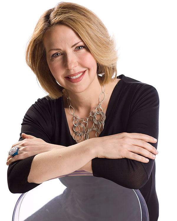 Jane in black sitting on chair