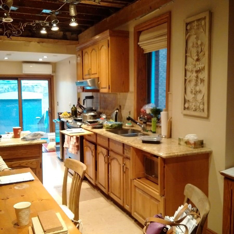 Old wood kitchen with beige and brown tones before renovation