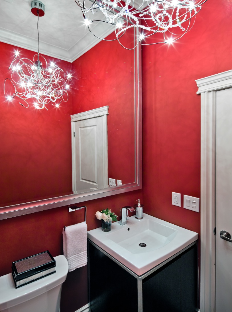 Bold red walls in powder room