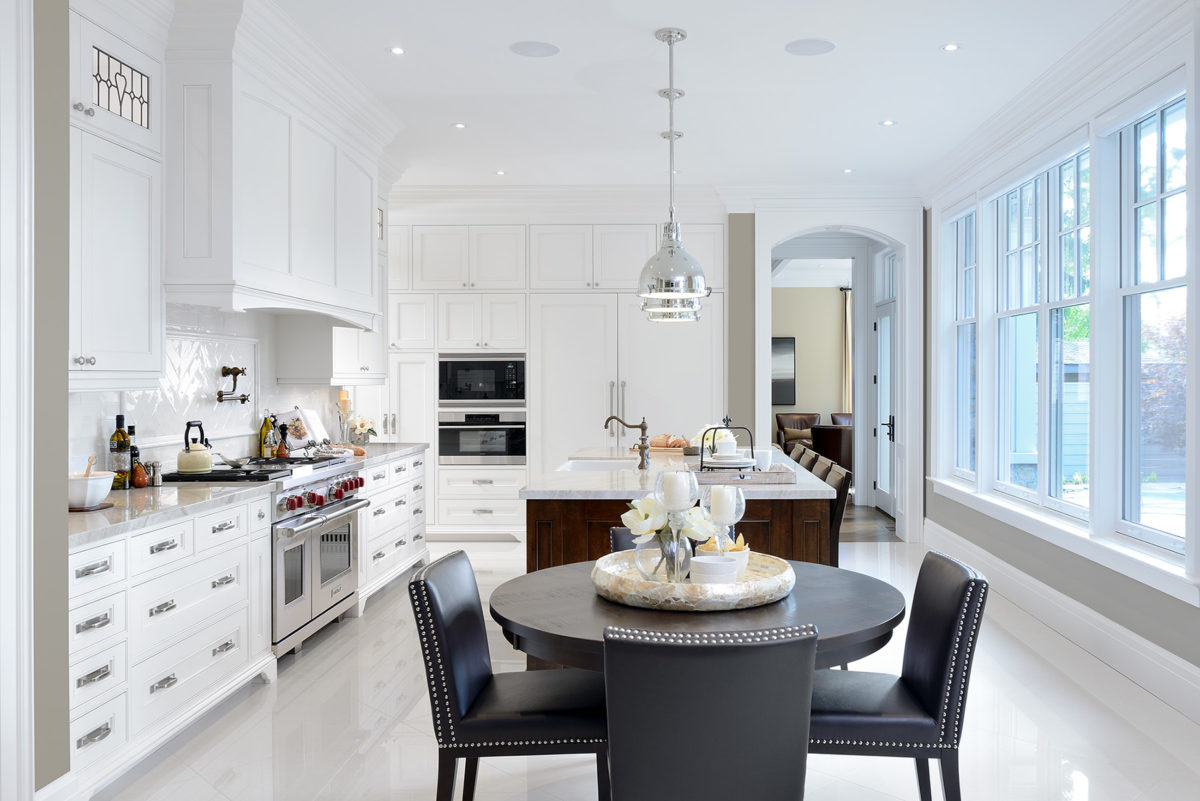 Long kitchen island and cabinetry with separate table