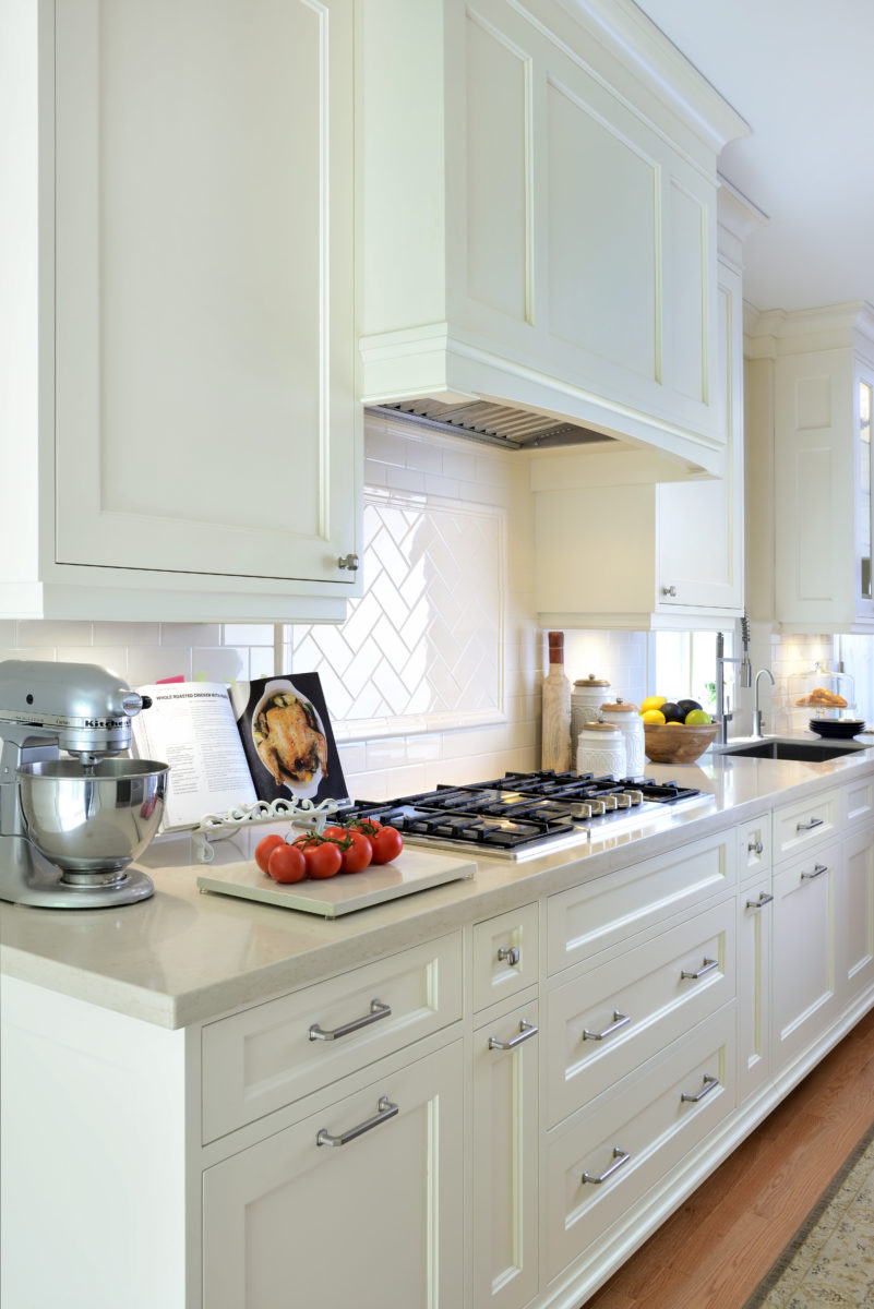 Five burner cook top in renovated kitchen