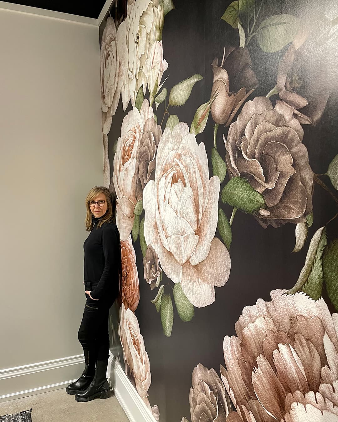 Jane Lockhart standing in front of wall mural