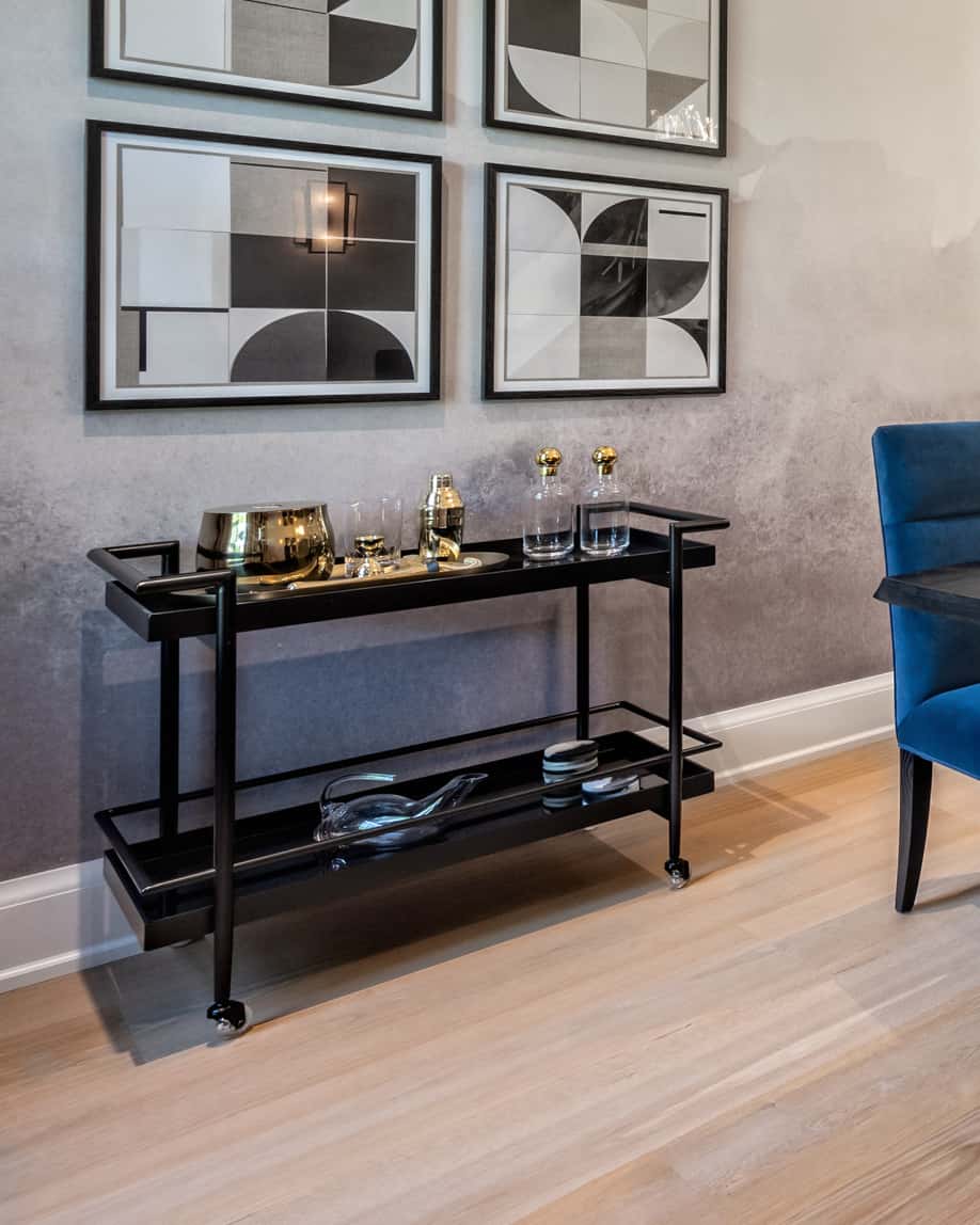 black frames and side table with honey oak floors