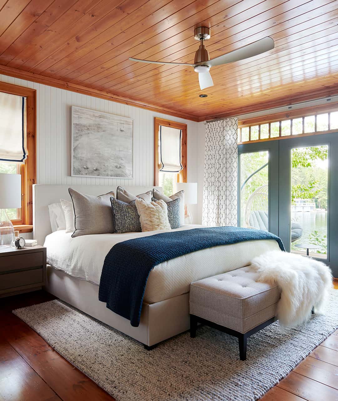 oversized white rug in bedroom on oak floor