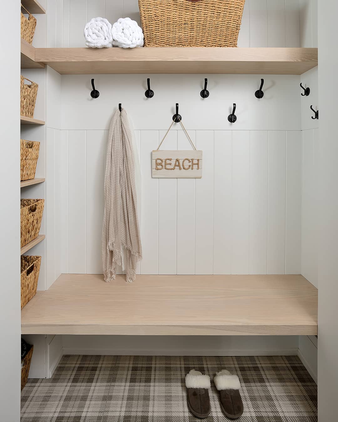 mudroom with baskets wood bench