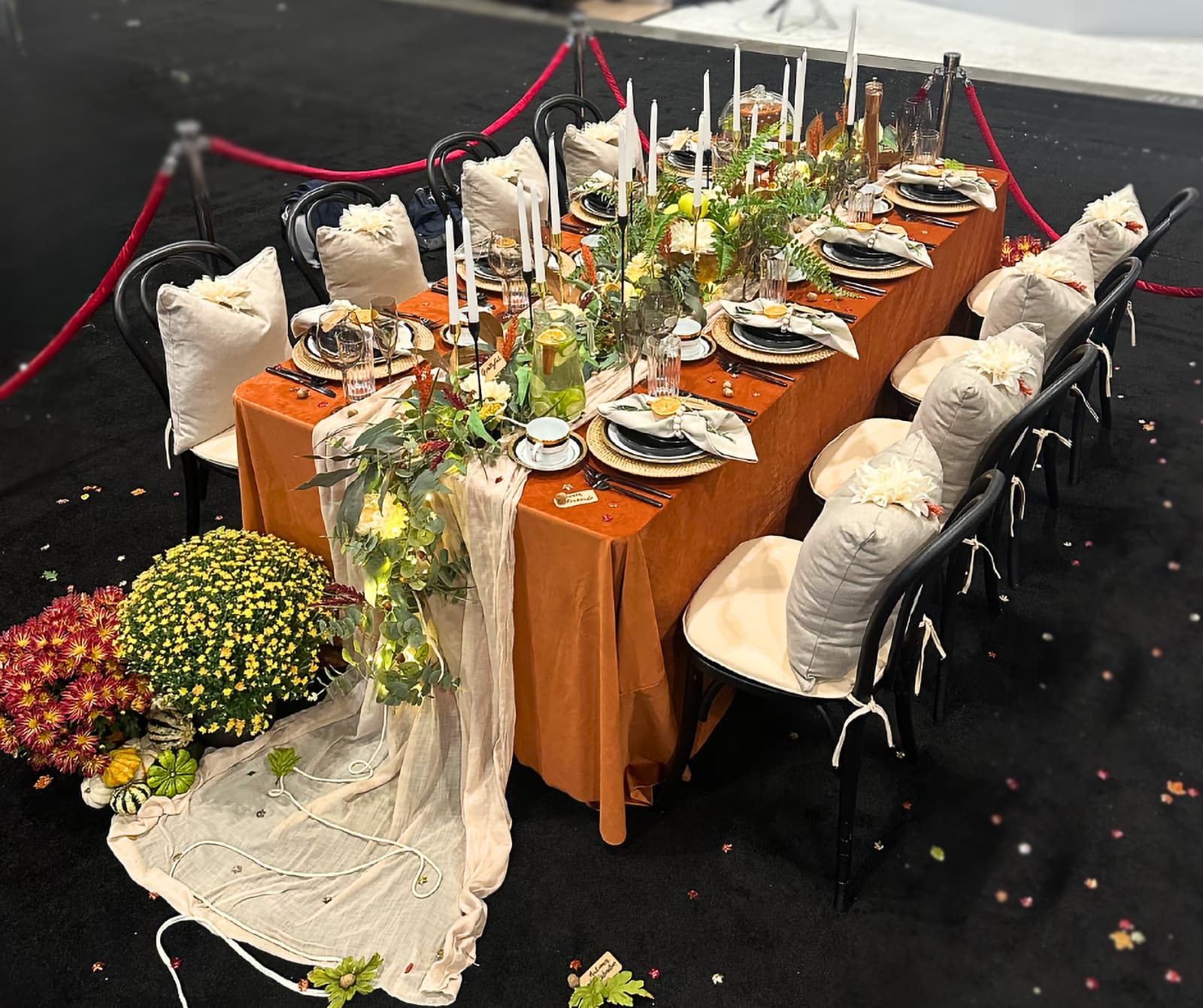 large dining table with fall colours and 8 seats