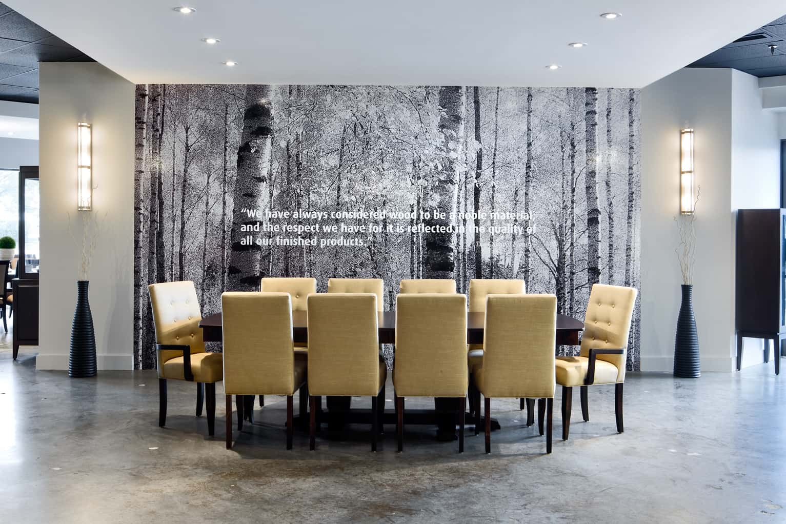 Boardroom table, yellow chairs, photo wall