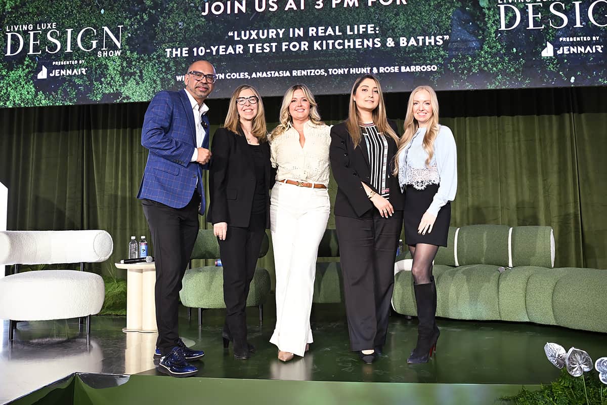 group shot of Jane and panel on stage