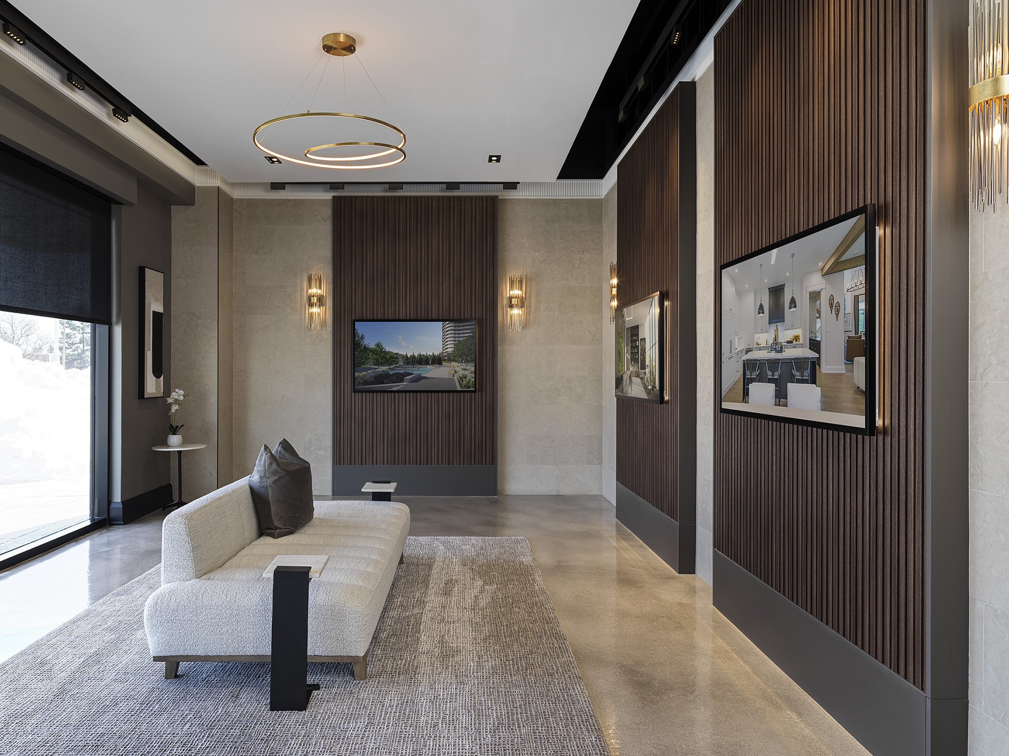 Presentation gallery at Primont XC featuring digital display walls, contemporary seating, and floor-to-ceiling windows for natural light