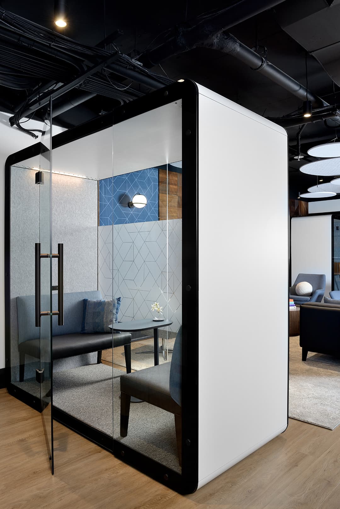 class enclosed meeting pod with 2 chairs