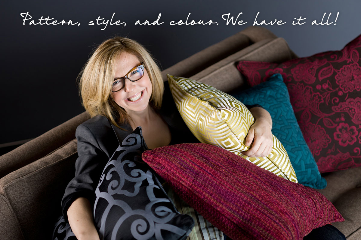 Jane Lockhart on a brown sofa with colourful pillows.