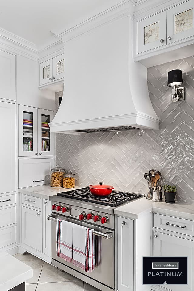 Wolf stove with white range hood and tile backsplash Jane Lockhart Design