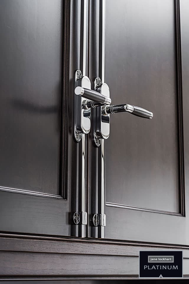 Decorative hardware handles on dark wood cabinetry