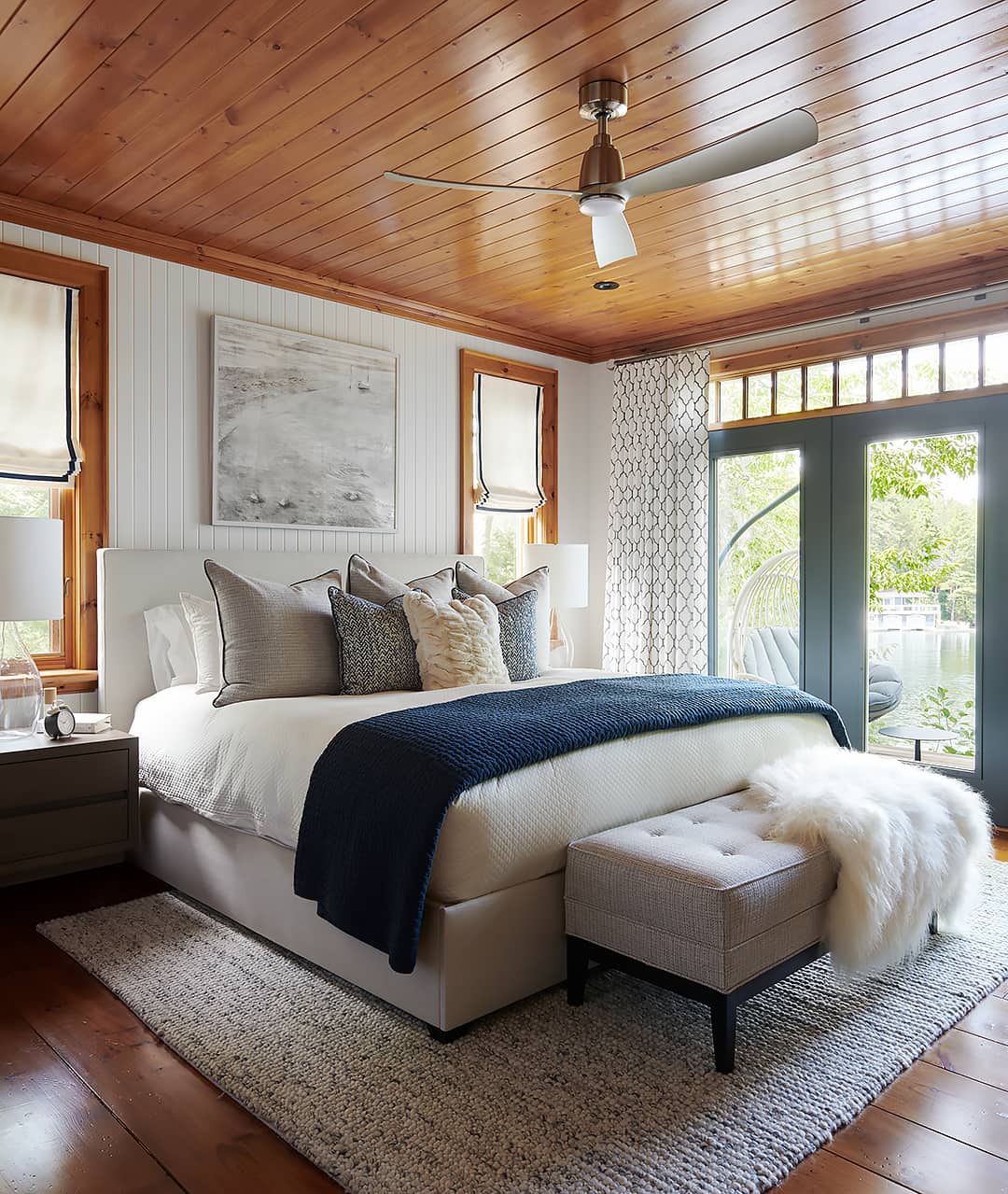 cottage bedroom with white wall and pine ceilings