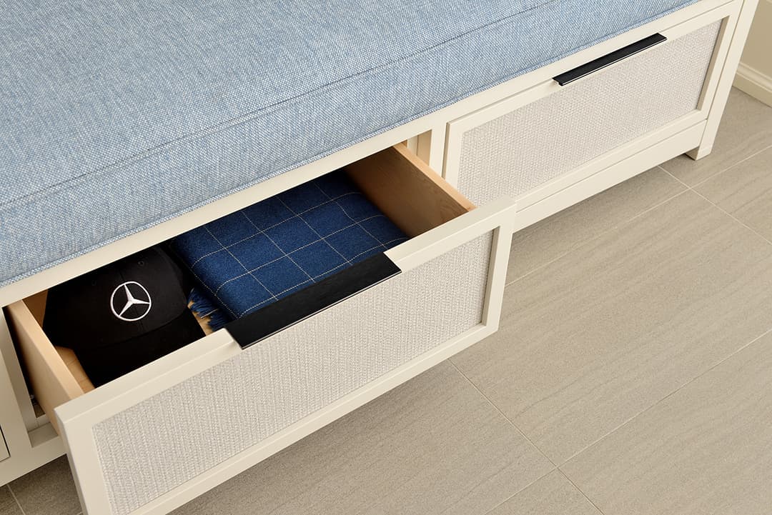 closeup of open drawer on bench with storage