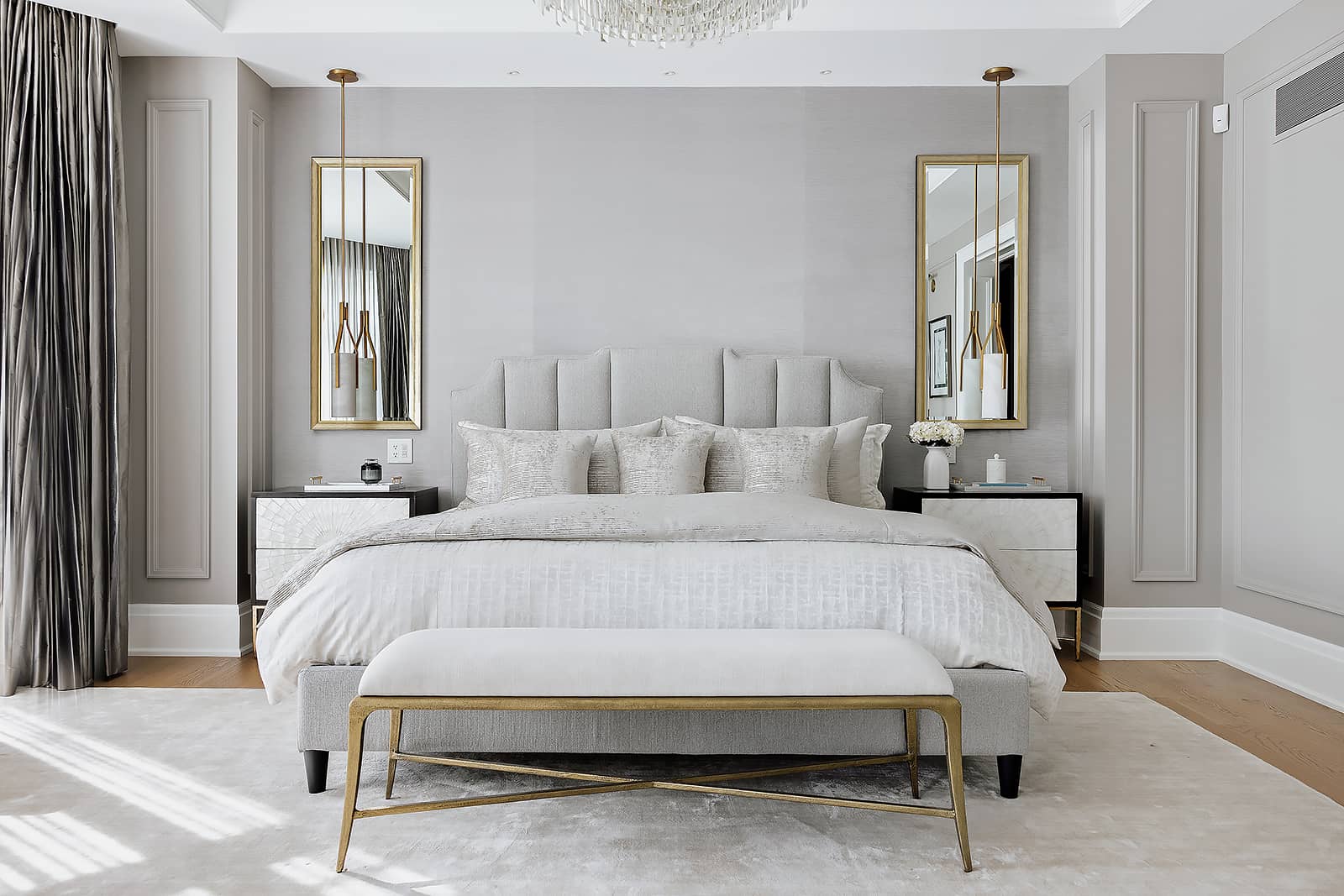 bright bedroom gray walls two mirrors side tables