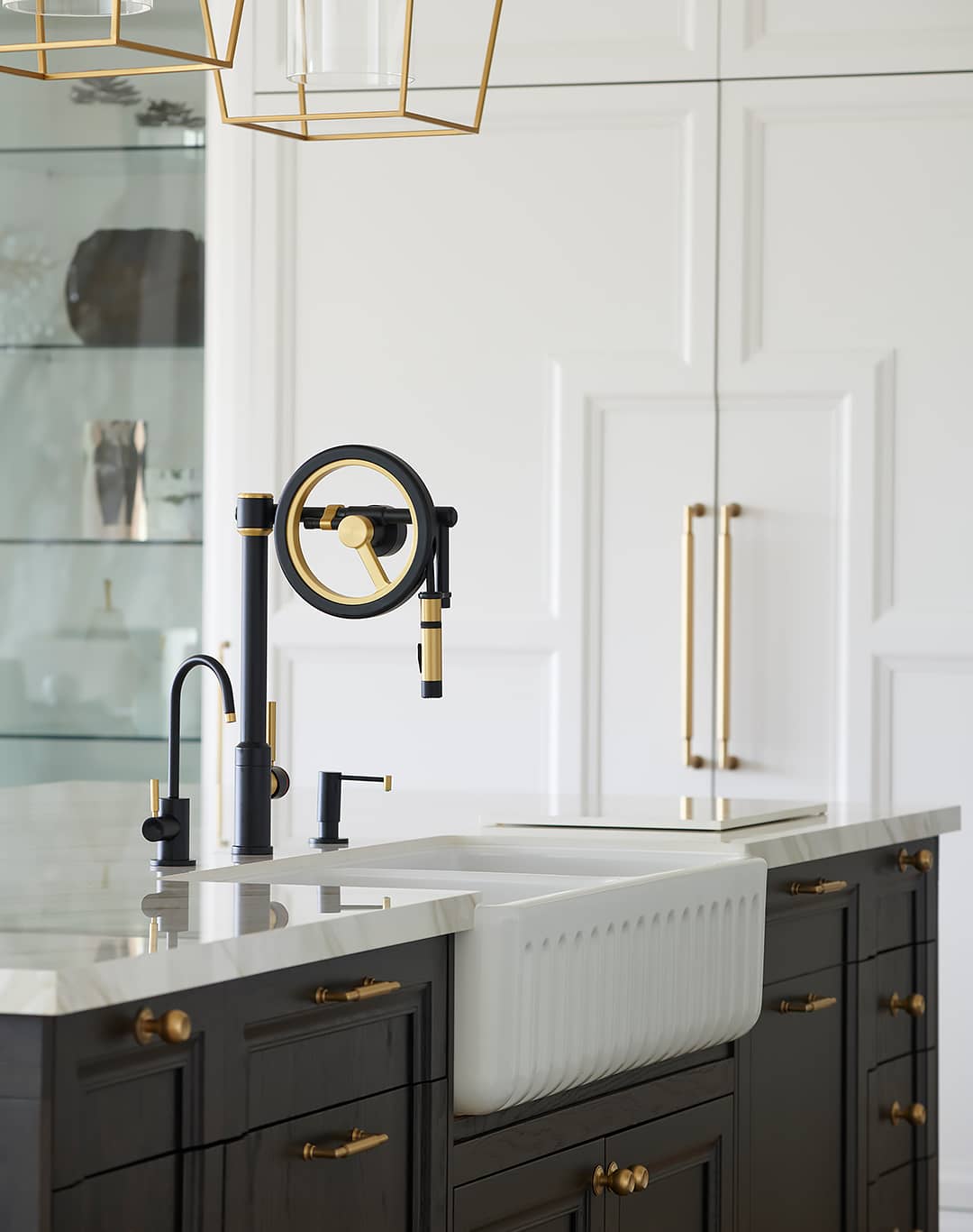apron sink with black and gold waterstone wheel faucet