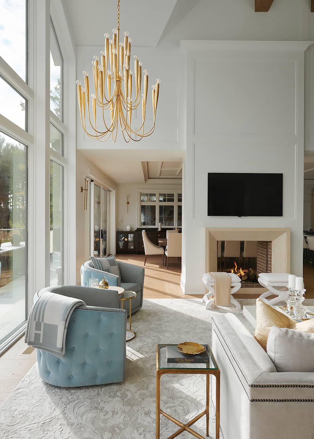 living room with gold chanelier
