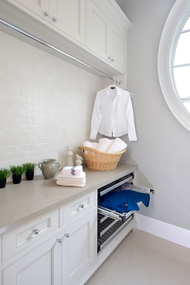 laundry room hanging rod with white shirt