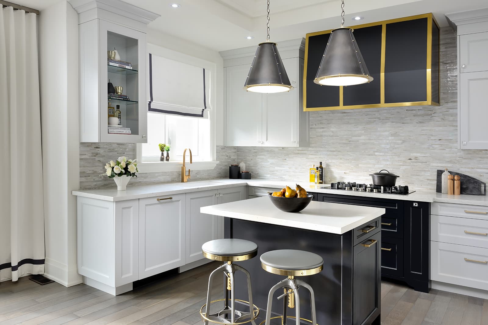 black and white kitchen with small island 2 black pendant lights